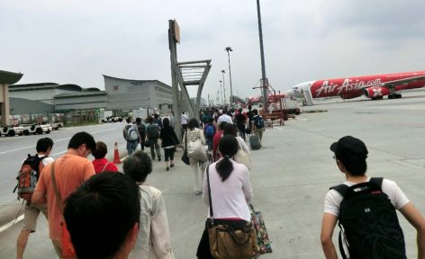 Arriving passengers walking to the Low-Cost Carrier Terminal (LCCT)